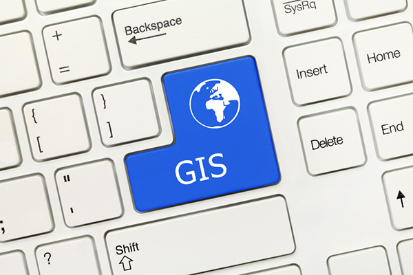 A keyboard with a blue GIS key
