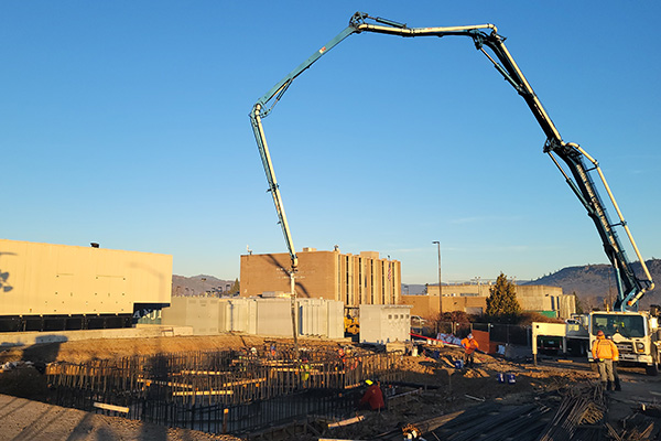 A crane moves supplies around on the workfield