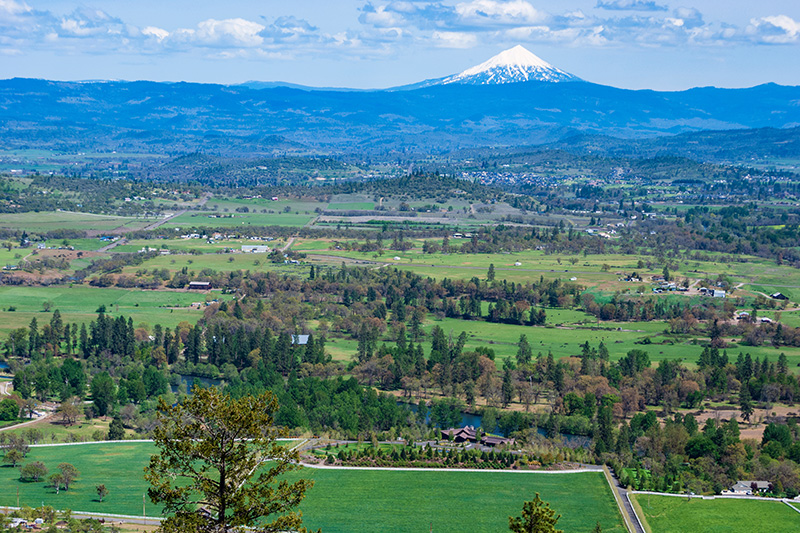 A richly saturated landscape view of Oregon and the snow capped mountain in the background.